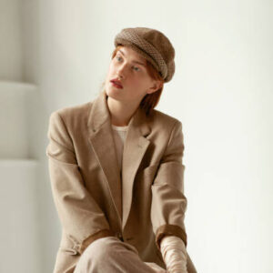 Retro studio portrait of a beautiful gatsby woman with ginger hair.