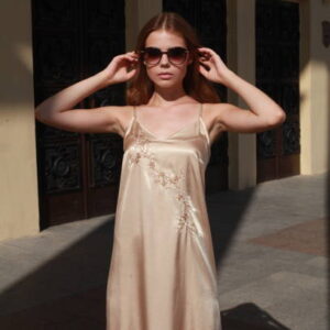 Young female model posing on footpath